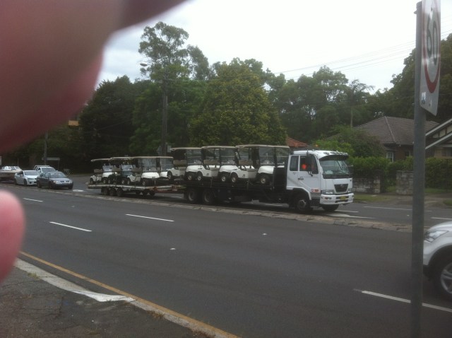 Golf-cart transporter, halfway between Roseville and Chatswood, 25 January 2014 (Black and Blue Man)